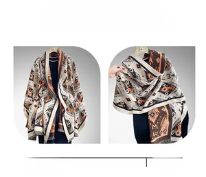 Detail of bohemian patterned winter scarf shawl with thick knit texture and tassels