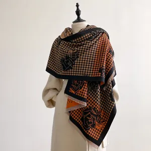Thick cashmere-like scarf with orange houndstooth and rose flower patterns and fringe