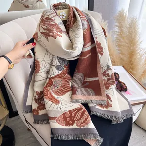 Detail shot of vintage floral pattern and delicate tassels on thick pashmina shawl