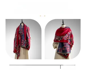 Detail of cashmere-like scarf with vintage floral paisley patterns and fringe edges