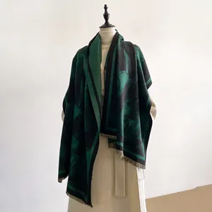 Winter tulip pattern dark green shawl scarf with fringe edges displayed on mannequin