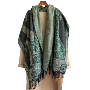 Vintage paisley jacquard cashmere-feel scarf with tassels on camel wool coat