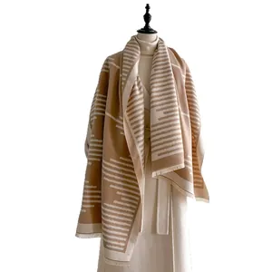 Elegant geometric faux cashmere shawl scarf in camel and beige with fringe trim