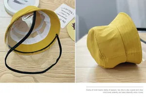 Detail of yellow cotton kids bucket hat with detachable transparent PVC face shield