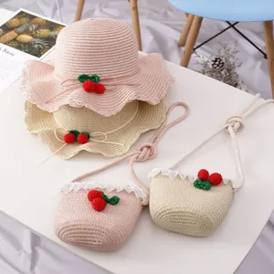 Kids straw hat and bag set with cherry accents and lace trim for summer beach outings