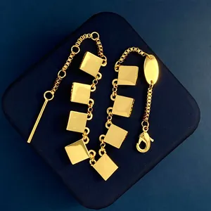 18K gold plated bracelet with square rivet charms and fringe links on a box chain