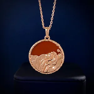 Macro detail of rose gold Leo zodiac pendant with relief lion and semi-precious stone