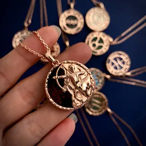 Rose gold Sagittarius constellation coin necklace with red gemstone inlay relief