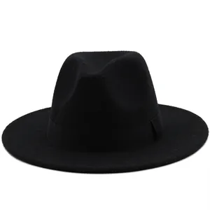 Detailed view of black wool fedora hat with a classic wide brim and matching grosgrain ribbon