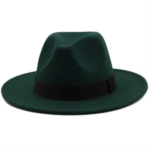 Detail of dark green fedora with black ribbon band and wide flat brim wool felt texture