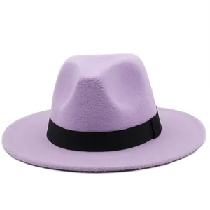 Detail of lavender wool fedora hat with wide black ribbon band and structured flat brim