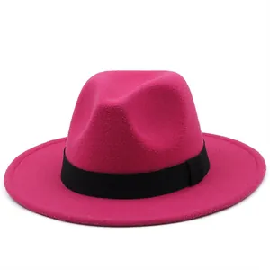 Detail of rose red wide brim wool fedora hat with a black grosgrain ribbon band