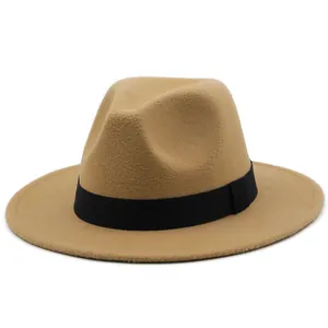 Close-up of a classic camel felt fedora with a wide brim and black ribbon detail