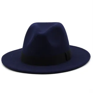 Detail view of a navy blue wool fedora hat featuring a classic black decorative ribbon