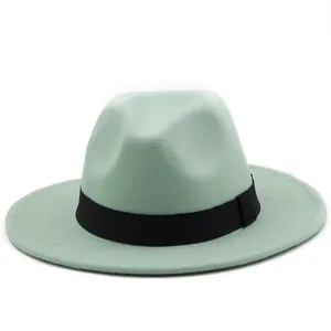 Detail of the mint green wool fedora with a wide flat brim and black decorative band