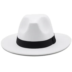 Detail of white wool fedora hat featuring classic teardrop crown and black ribbon band