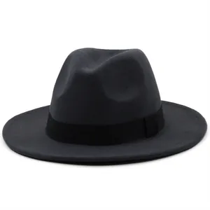 Detailed texture of dark grey felt fedora hat with wide black grosgrain ribbon band