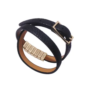 Double wrap black leather bracelet with gold metal buckle and engraved beads