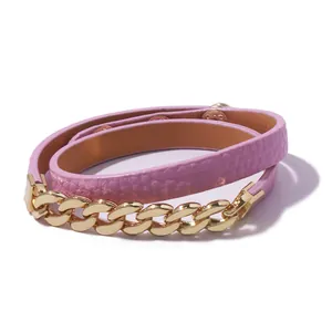 Detail of pink leather wrap bracelet with chunky gold chain links and metallic buckle