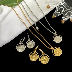 Detailed macro view of vintage coin necklaces and earrings set in gold and silver finish