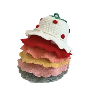 Detailed knit texture and ruffled brim of strawberry-themed baby sun hats in six colors