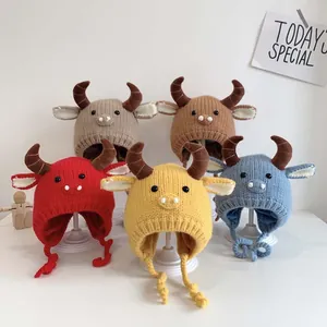 Collection of five colorful knit baby hats with cute bull horns and warm fleece lining