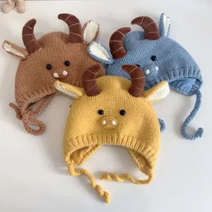 Detailed knit texture of baby earflap hats with 3D horns and ears in multiple colors