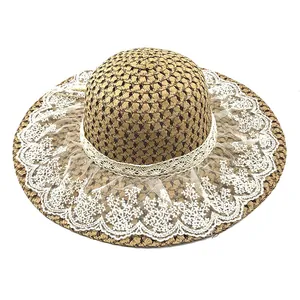 Lace straw hat with wide brim for sun protection featuring floral mesh and ribbon details