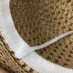 Inside view of a woven straw sun hat with breathable mesh sweatband and elastic chin strap