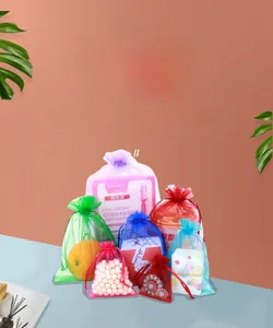 Variety of colorful organza drawstring bags for jewelry and gifts packaging