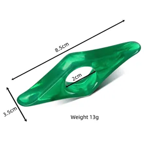 Green transparent acrylic thumb book holder for reading with detailed dimensions and weight
