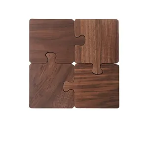 Set of 4 walnut wood puzzle coasters with natural grain in a square interlocking design