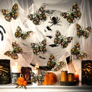 Macro shot of 3D Halloween butterfly stickers with skull and floral patterns on spider web