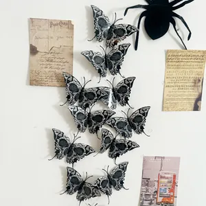 Close-up of 3D gothic skull butterfly wall stickers with spider and vintage postcard decor