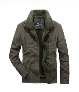 Close-up of olive green military jacket showing thick fleece lining and embroidery detail