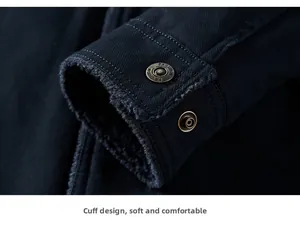 Detail of winter jacket cuff with warm fleece lining and embossed metal snap buttons