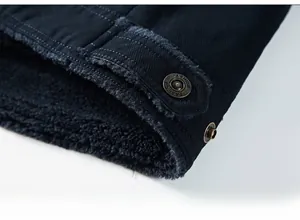 Close-up of winter jacket hem with metal snap button and thick fleece lining texture