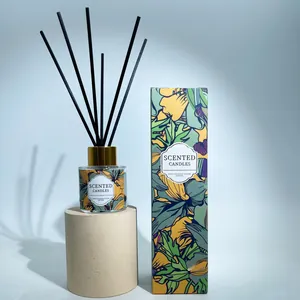 Detail of elegant glass reed diffuser set with floral box and black fiber sticks