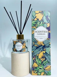 Detailed view of luxury indoor reed diffuser set with floral packaging and glass bottle