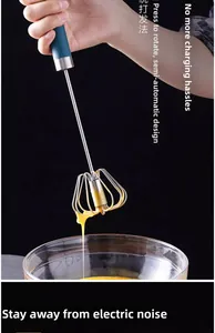 Macro shot of semi-automatic stainless steel whisk rotating manually in a glass bowl