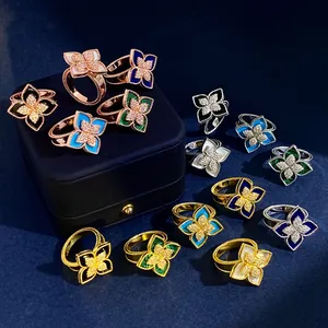 Luxe rhodium and gold plated diamond clover rings set with mother of pearl and malachite