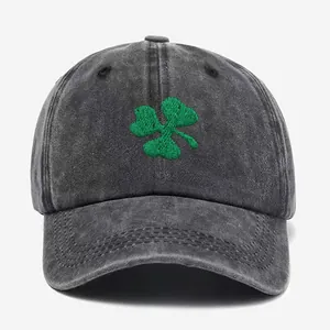 Washed dark gray baseball cap featuring green clover embroidery with a wide brim