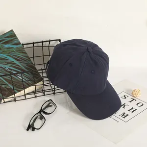 Classic dark blue cotton baseball cap with six-panel structure and curved brim for unisex style