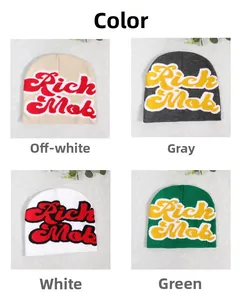 Detail view of knitted beanies showing beige, grey, white, and green color options