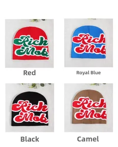Detail view of knit beanies with Rich Mob jacquard lettering in four vibrant colors