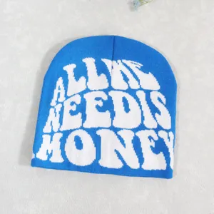 Detail of the navy blue knit beanie featuring large white jacquard lettered embroidery