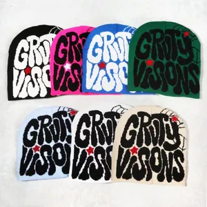 Collection of seven colorful knitted beanies with Dirty Visions graffiti text and star design