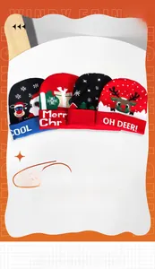 Detail of Christmas knitted beanies with Santa and reindeer festive embroidery