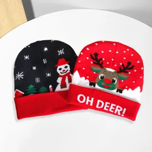 Christmas themed knit beanies in red and black with snowflakes, snowmen and reindeer patterns