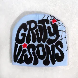 Light blue knit beanie featuring black Grody Visions lettering and red star patterns